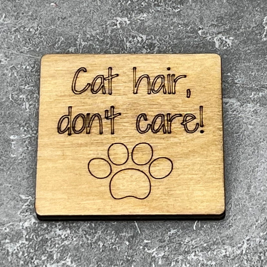 2" wood square with “Dog hair, don’t care! {cat paw}“ laser engraved