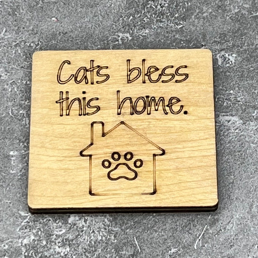 2" wood square with “Cat’s bless this home {house paw}“ laser engraved