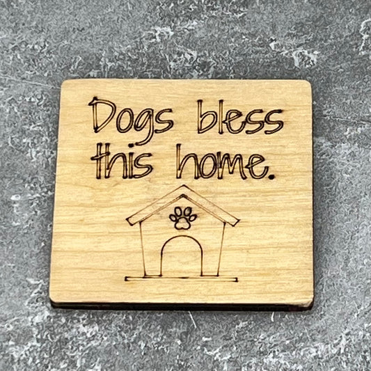 2" wood square with “Dogs bless this home {dog house}“ laser engraved
