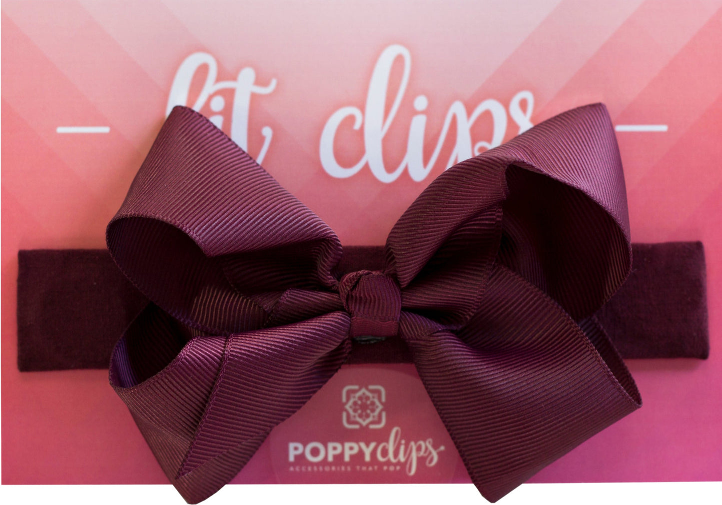 5 ¼” long by 7/8” wide burgundy material with magnets at each end. Centered on the outside is a double burgundy bow that is approximately 4” across.
