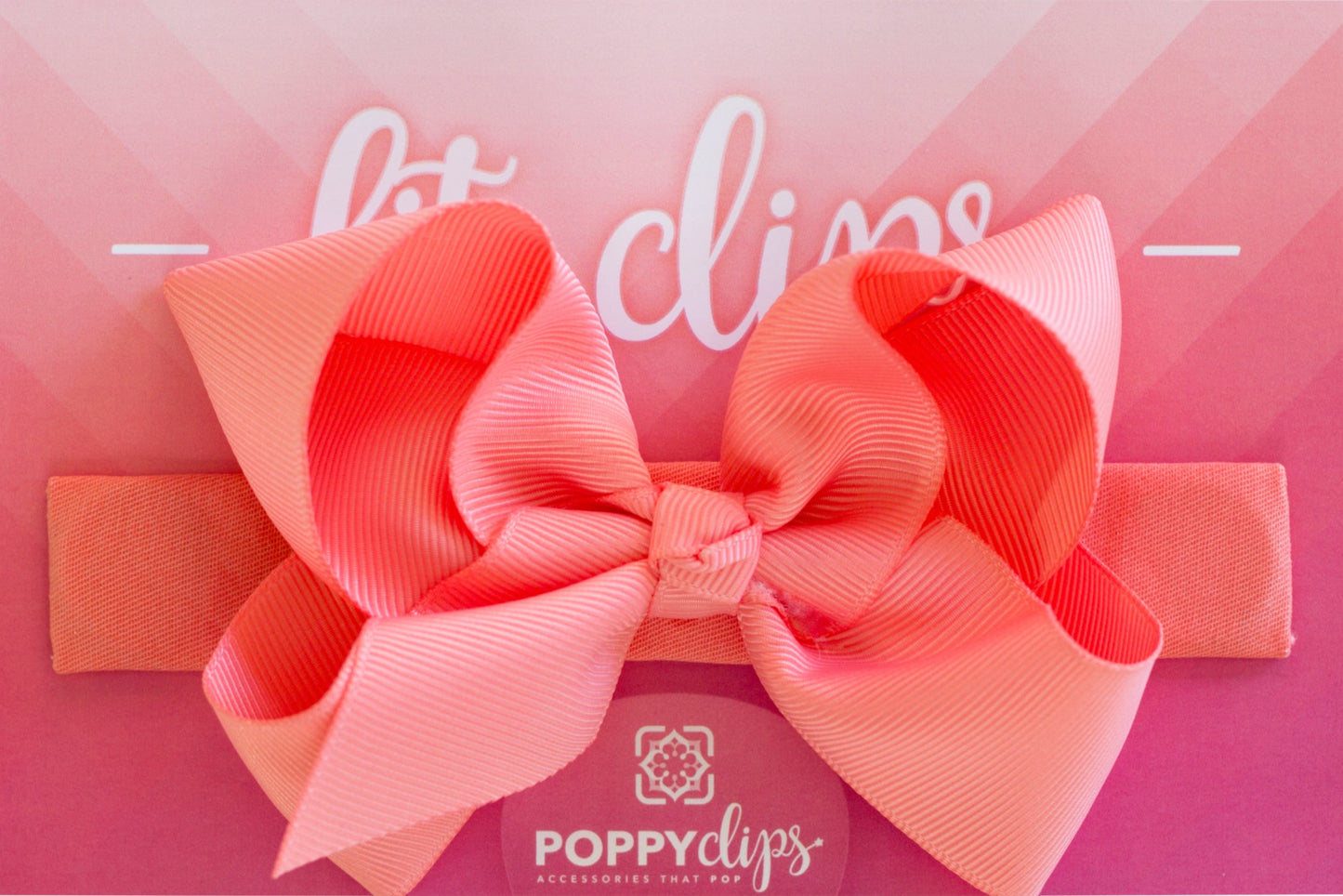 5 ¼” long by 7/8” wide coral material with hidden magnets at each end. Centered on the outside is a double coral bow that is approximately 4” across.