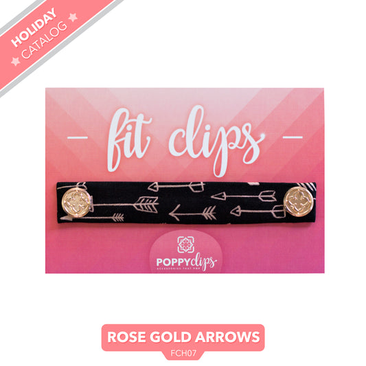 5 ¼” long by 7/8” wide black material with a variety of pink arrows and a magnet at each end.  The outer magnets are a decorative rose gold medallion with the company logo. 