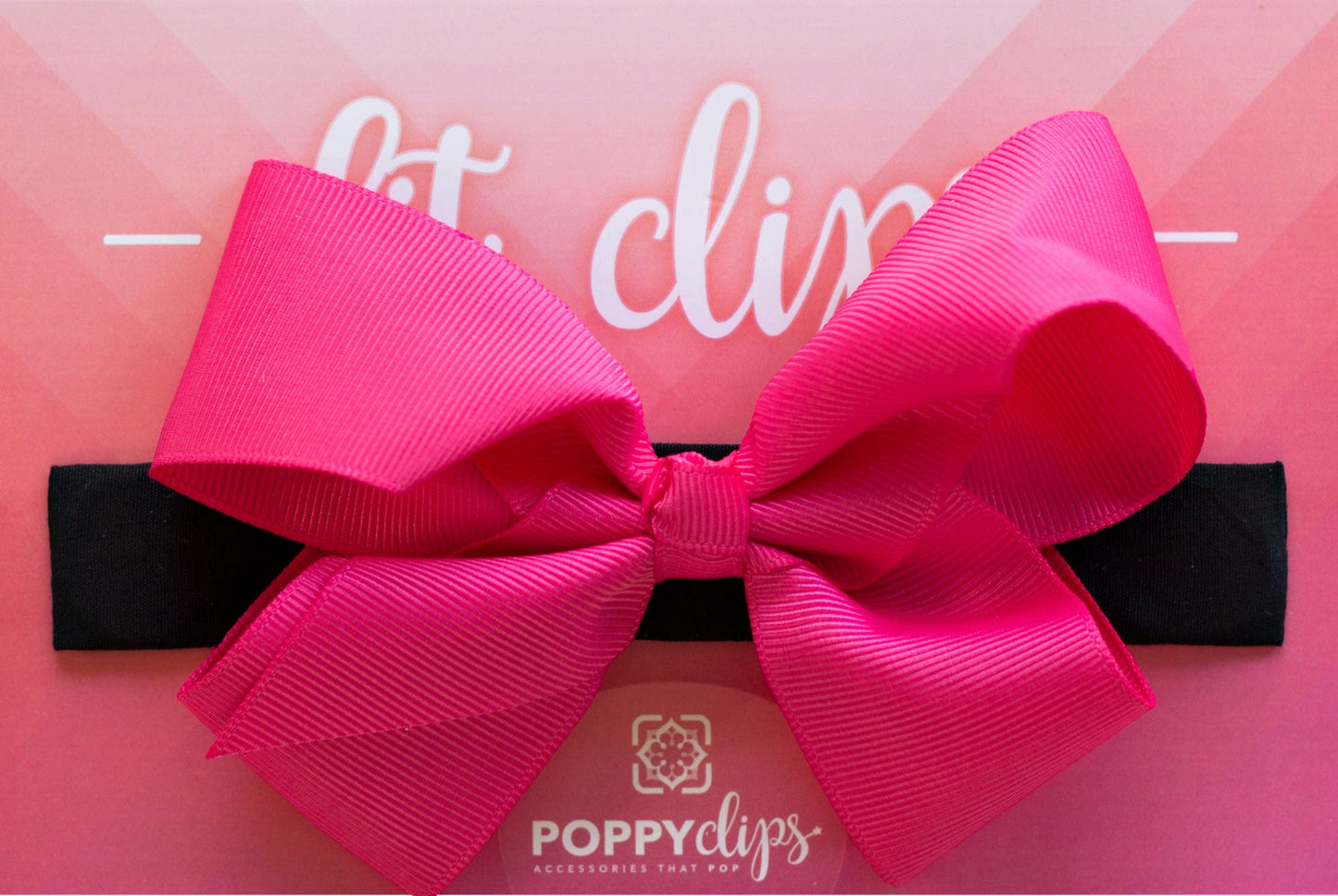 5 ¼” long by 7/8” wide black material with hidden magnets at each end. Centered on the outside is a double hot pink bow that is approximately 4” across.