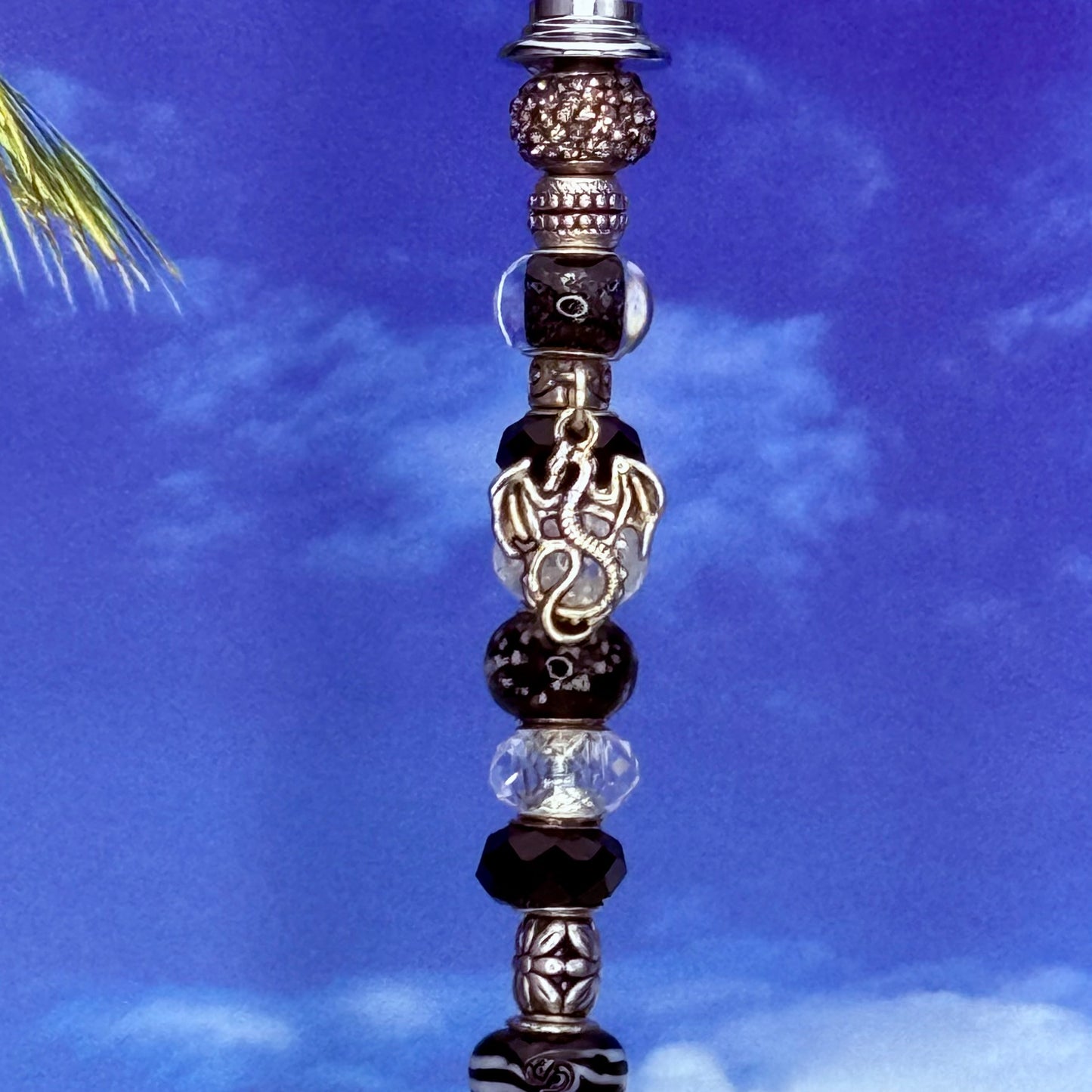 Black metal garden stake featuring a Fire & Ice dragon design — fantasy outdoor décor.