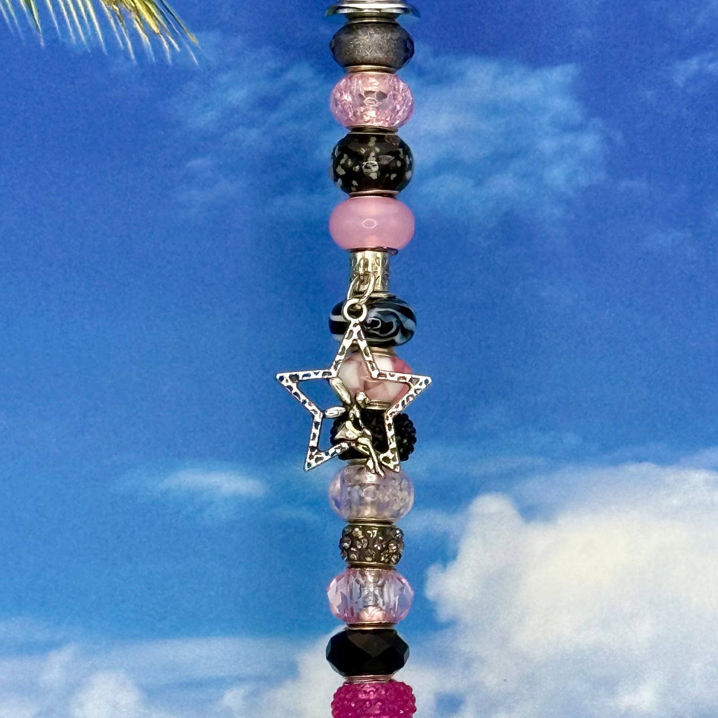 Black and pink metal garden stake ‘Twilight Fairy Stardust’ with whimsical fairy design — enchanting outdoor décor.