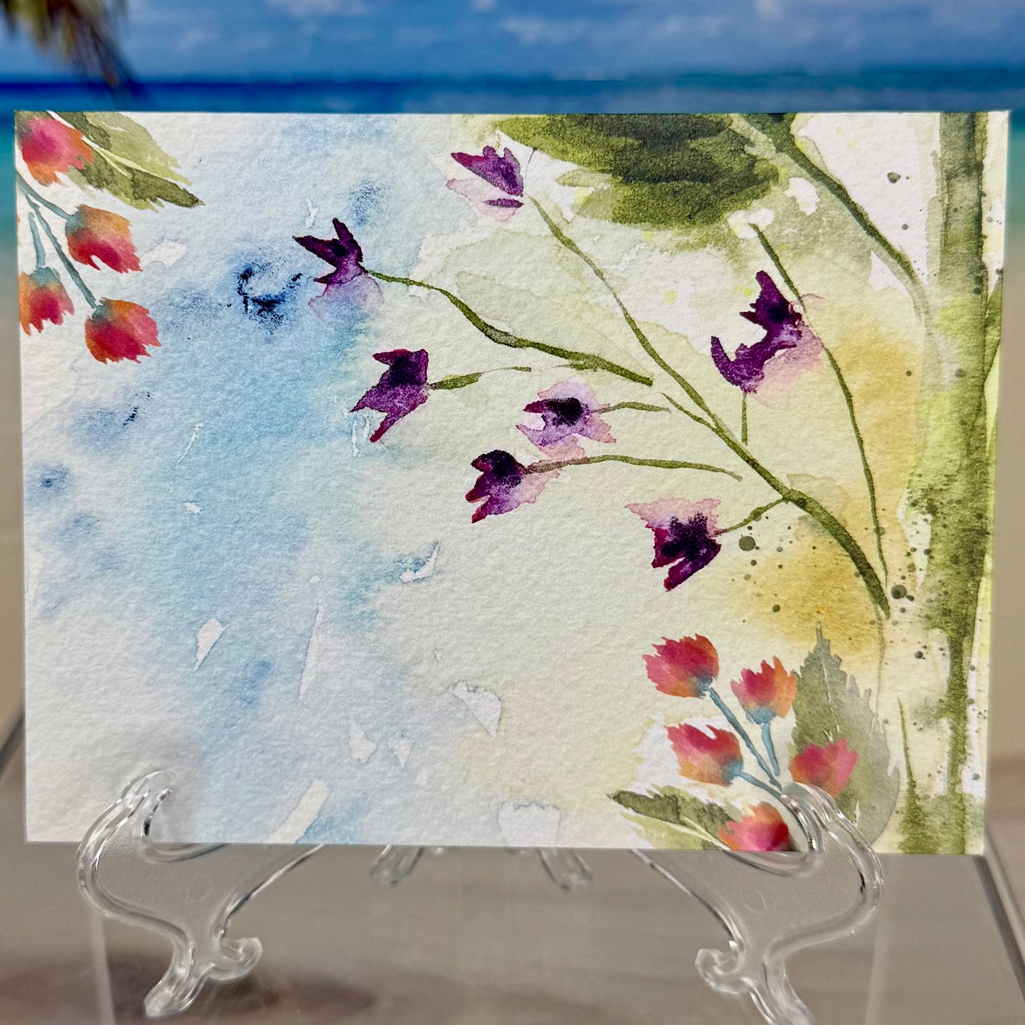 Back of a greeting card with beautiful flower & bee illustrations and the message “For a one-of-a-kind friend”