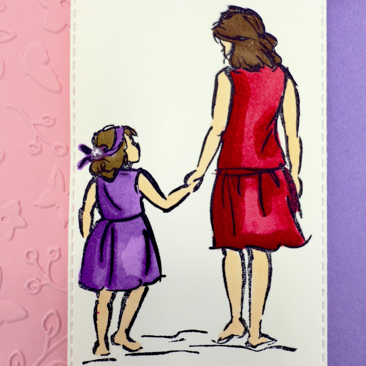 Purple Mother's Day greeting card with the message ‘Happy Mother’s Day’ in elegant lettering and an illustration of a mother and daughter, paired with its matching envelope — a heartfelt and handcrafted card for mom.