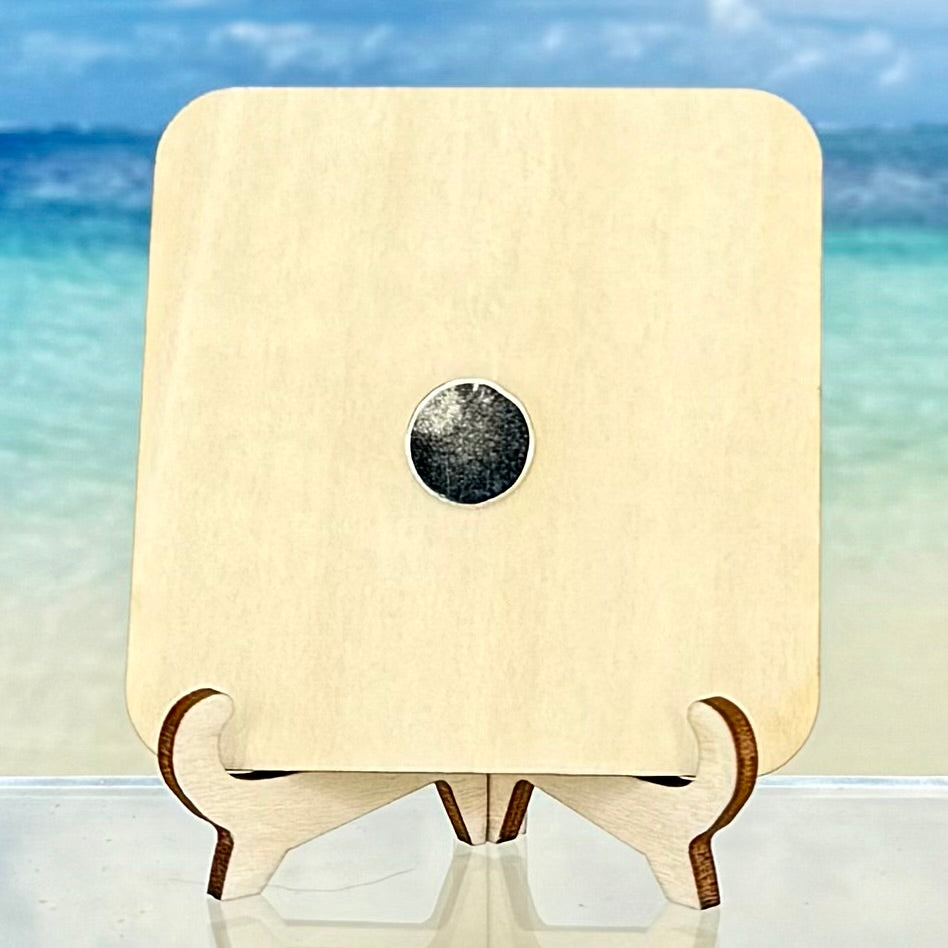 Back view of a wooden fridge magnet showing smooth laser-cut edges and a strong round magnet attached at the center.