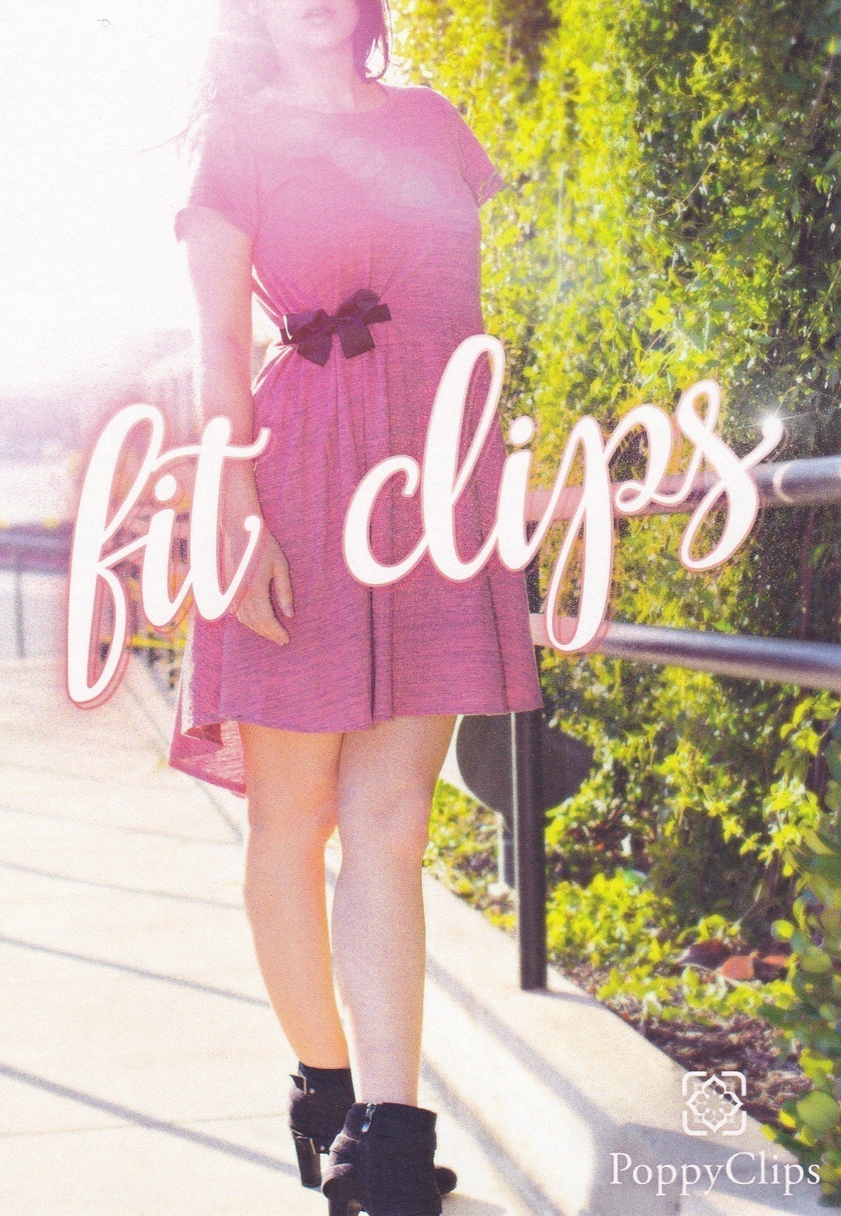 Front of packaging, showing a female in a pink dress with a black bow fitclip, off centered to to her right – very cute! And the logo, ‘fit clips’ across the front. 