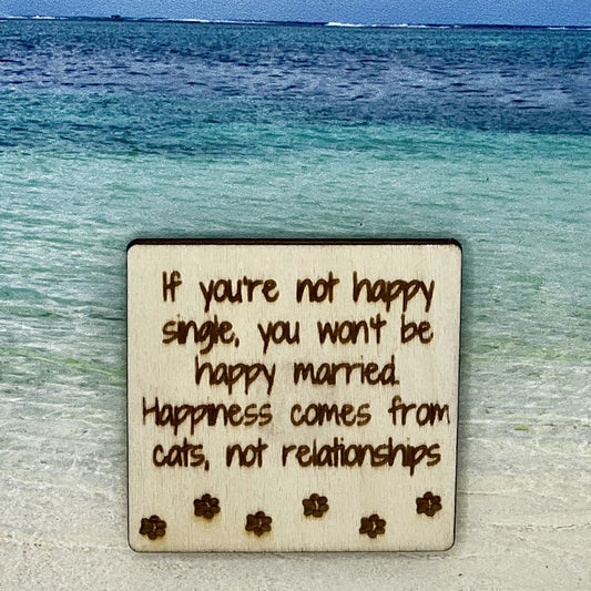 2”x2” wooden square with “ If You Are Not Happy Single, You Won't Be Happy Married. Happiness Comes From Cats, Not Relationships“  and paw prints laser engraved. Background scene is a tropical ocean.