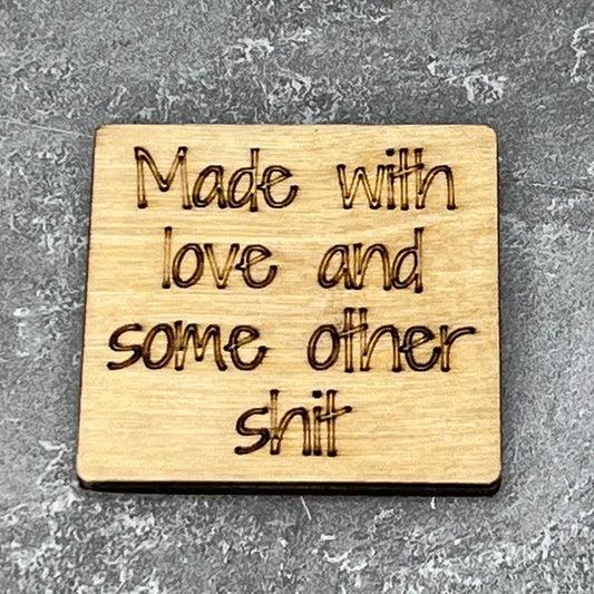 2" wood square with “Made with love and some other shit“ laser engraved