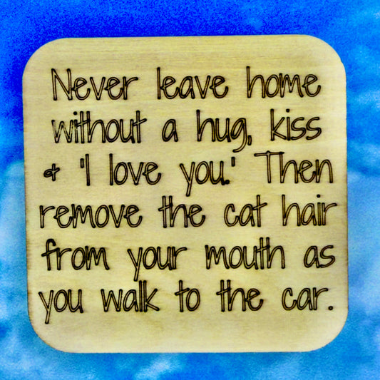 2.5" basewood square with “A house is not a home without a dog“ laser engraved text with image of dog paws.