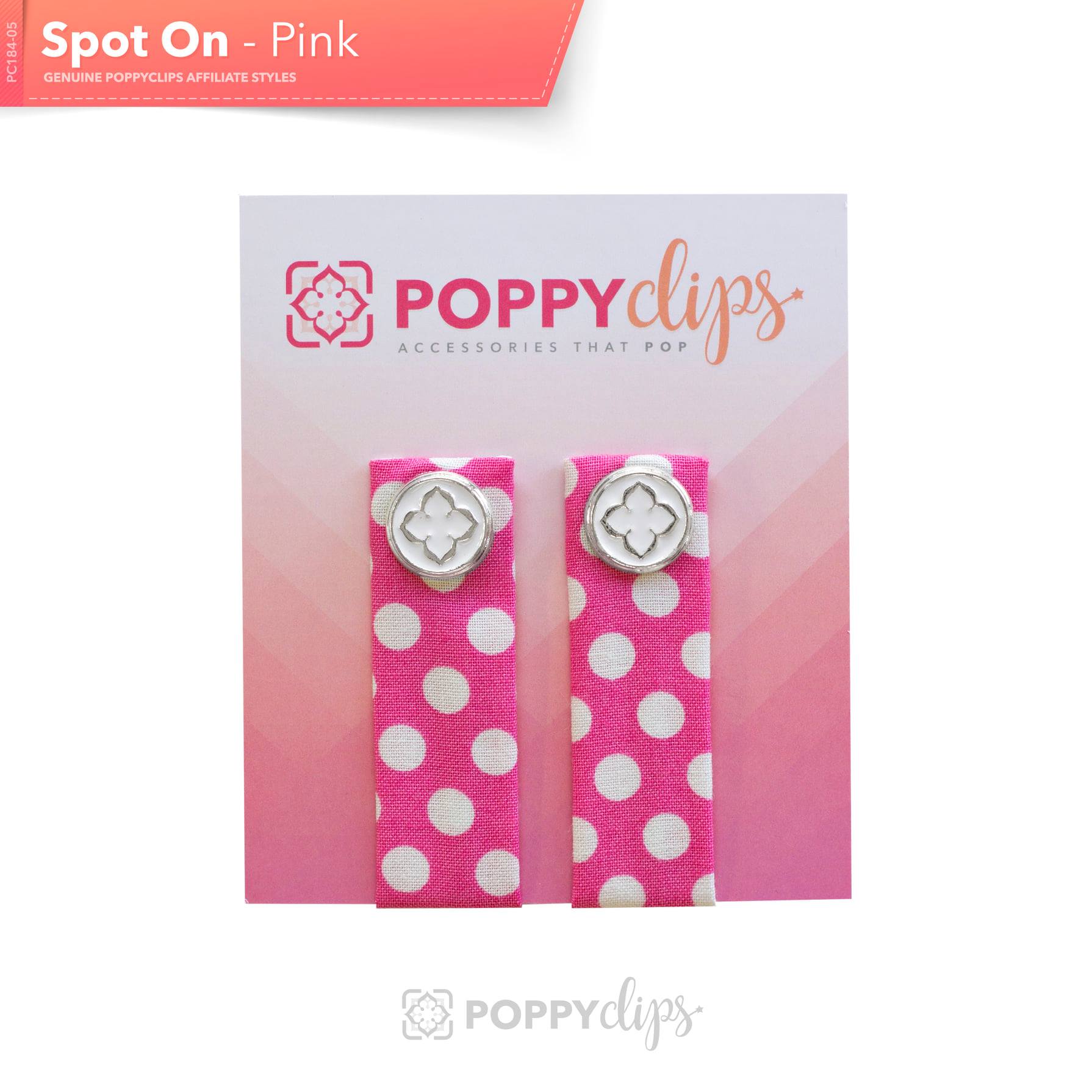 Two 5 ¼” long by 7/8” wide bright pink material with white polka dots, and a magnet at each end.  The outer magnet is a decorative silver medallion with the company logo. 