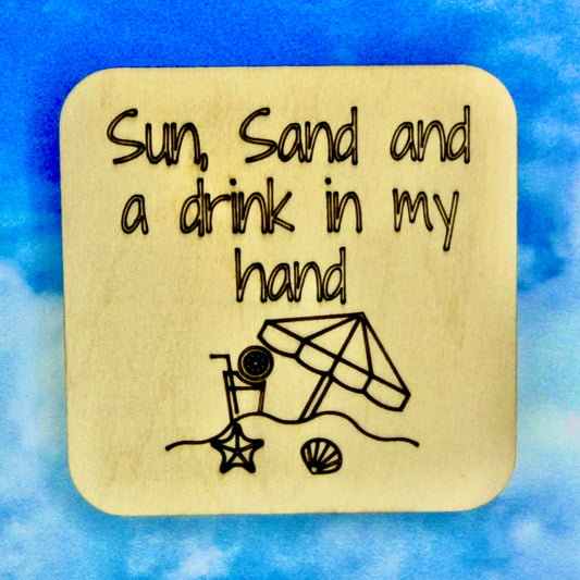 2.5" basewood square with “Sun, Sand, and a drink in my hand“ laser engraved text with an image of a beach scene.