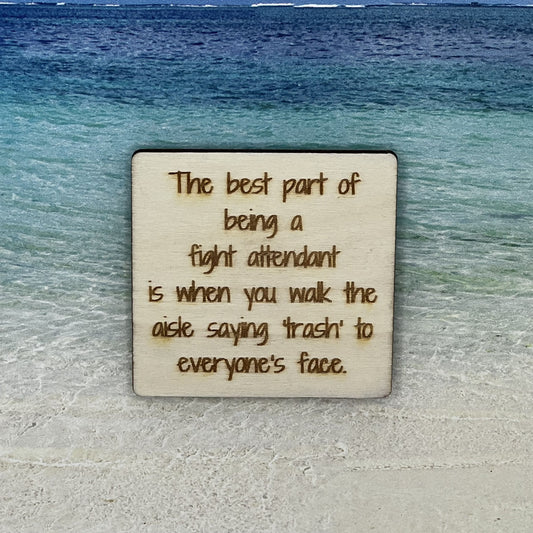 2”x2” wooden square with “The Best Part of Being a Flight Attendant Is When You Walk the Aisle Saying 'Trash' to Everyone's face.“ laser engraved. Background scene is a tropical ocean.