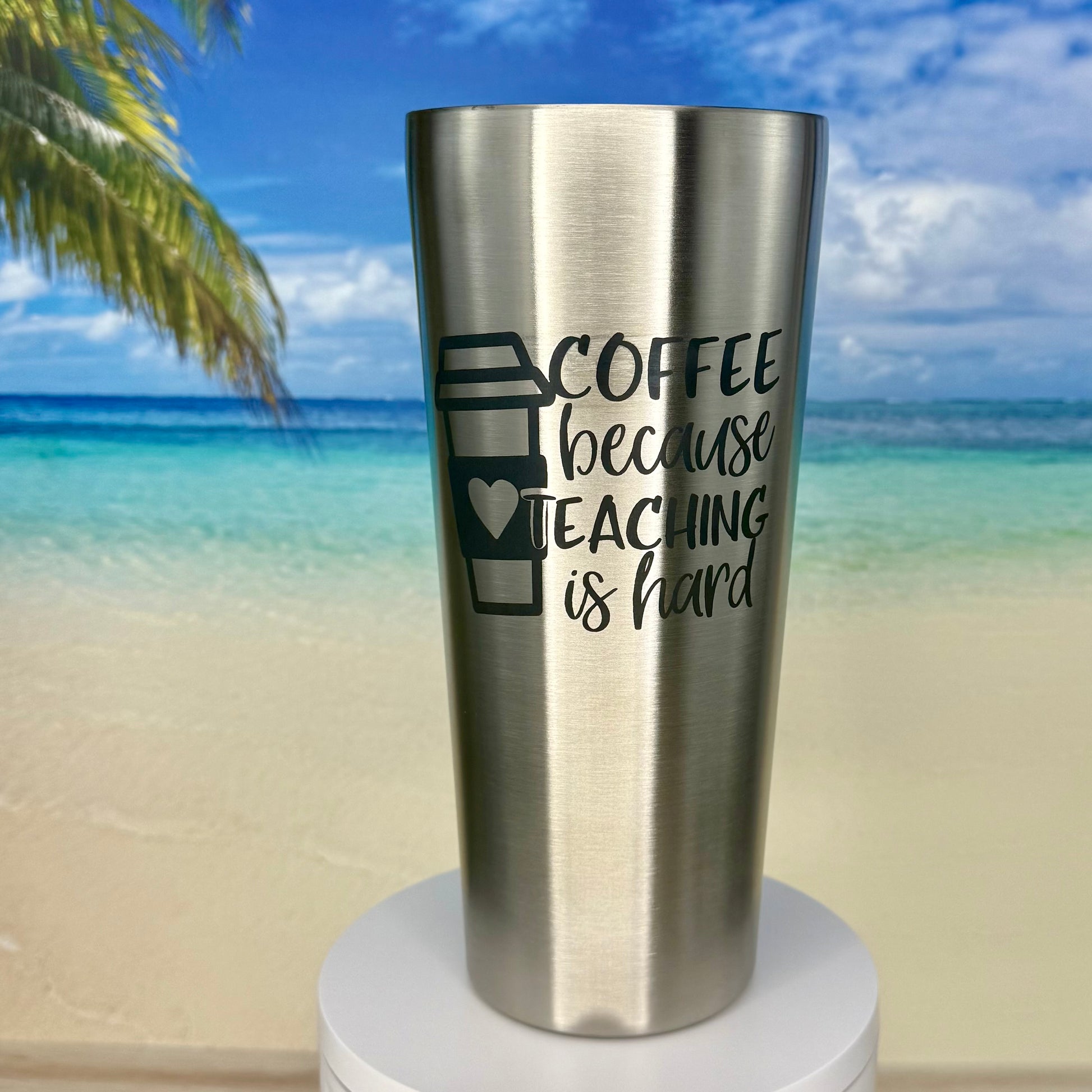 Stainless steel tumbler with “Coffee Because Teaching Is Hard” coffee‑themed design on the front.