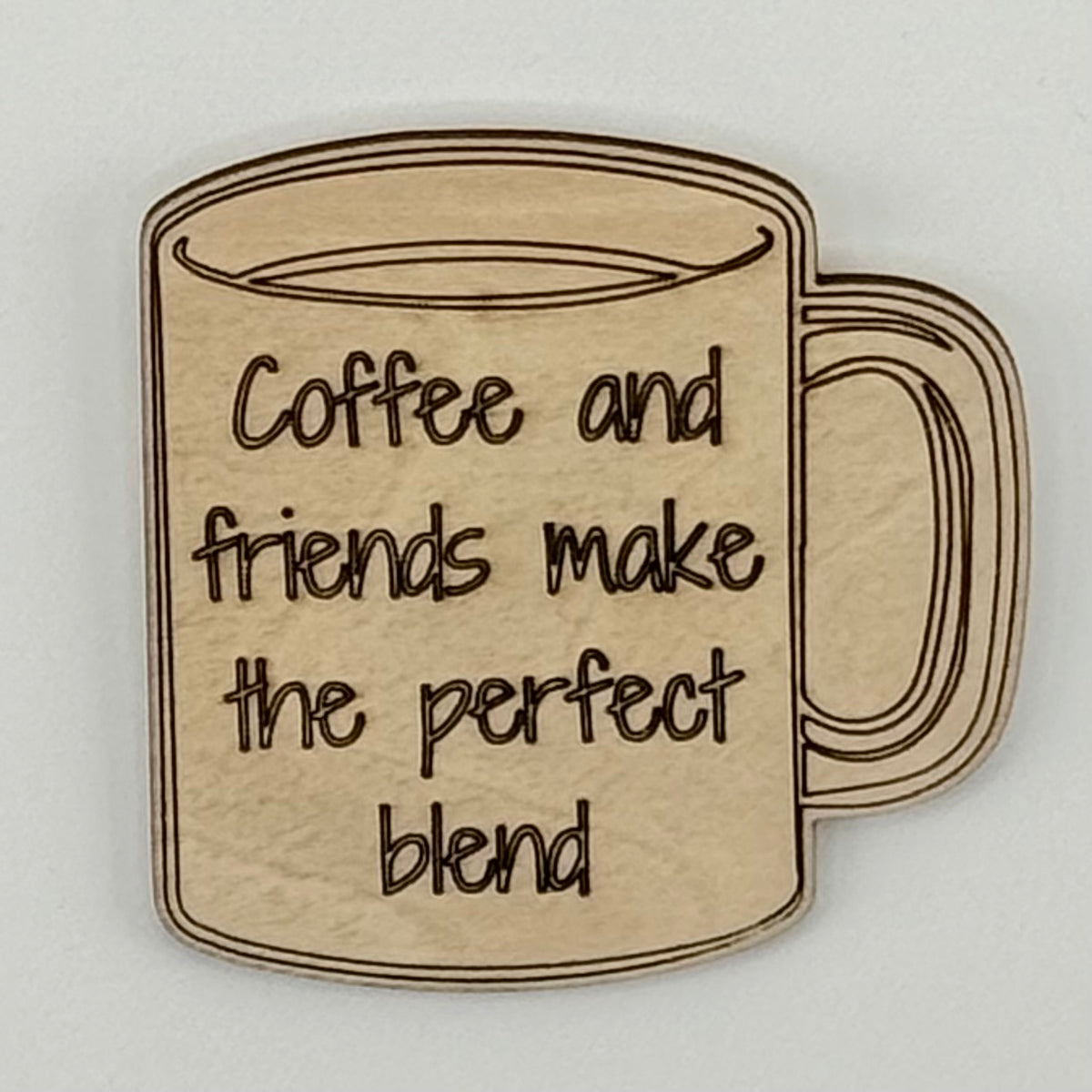 Laser-cut wooden fridge magnet engraved with the quote ‘Coffee and friends make the perfect blend’ — handcrafted décor for coffee lovers and friendship moments.