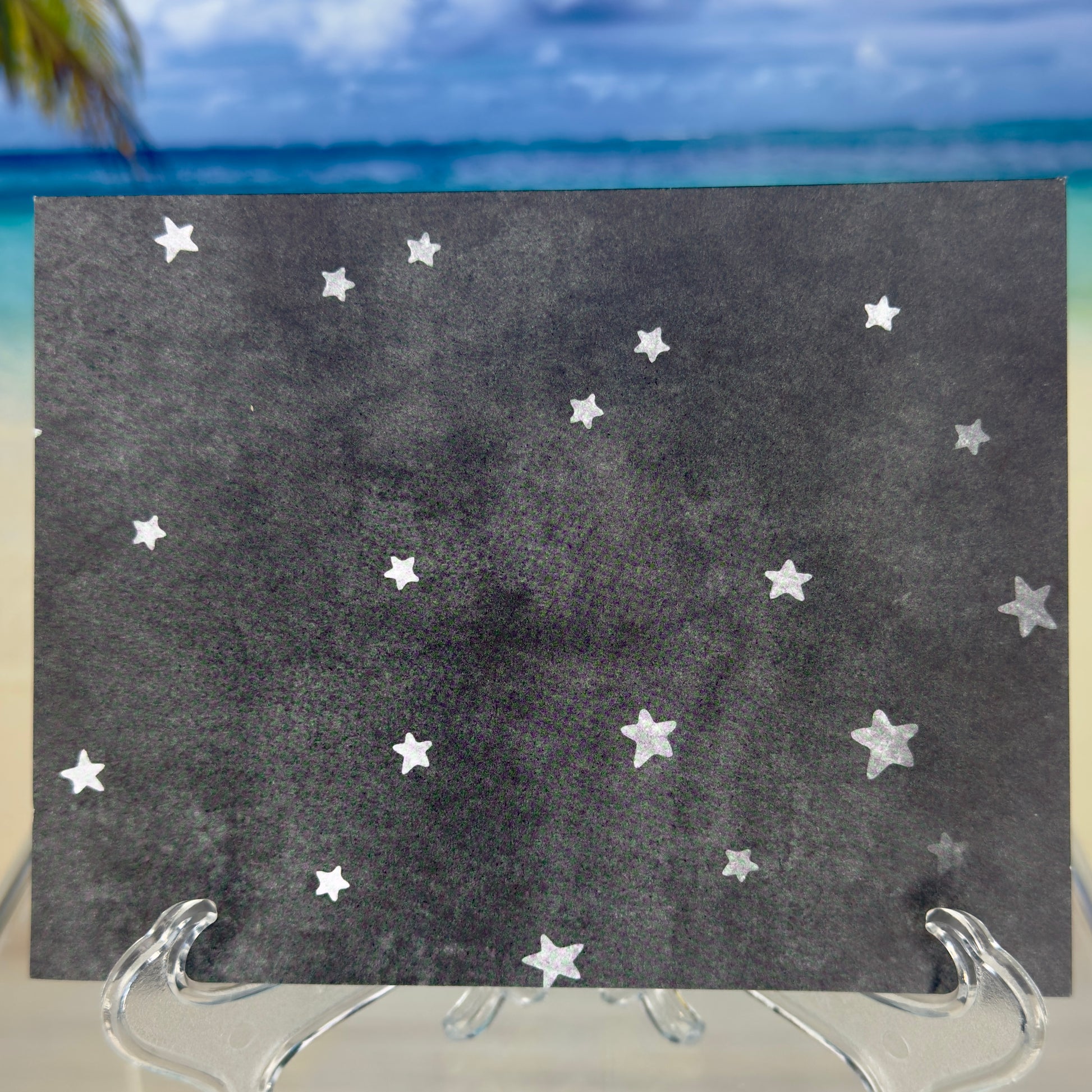 Back of the ‘Every Day Is a New Day’ greeting card featuring a star-filled night sky.