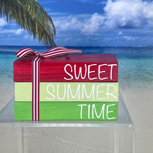 Faux book stack in vibrant red and green tones with coordinating ribbon, handcrafted from pine wood—‘Sweet Summer Time’ décor piece perfect for shelves, mantels, or coffee tables.