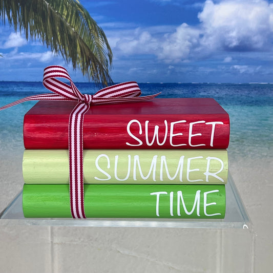Rounded faux book stack titled ‘Sweet Summer Time,’ handcrafted from pine wood and painted in vibrant red, light green and green tones, wrapped with red-and-white striped ribbon—perfect for adding cheerful summer decor to shelves or coffee tables.
