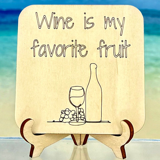 Fridge magnet with quote ‘Wine is my favorite fruit’ featuring wine bottle, glass, and grapes — funny wine lover decor.