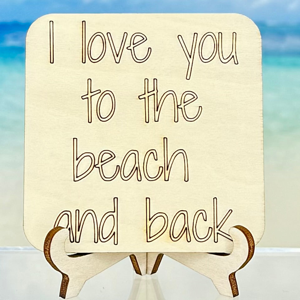 Wood‑style fridge magnet: ‘I love you to the beach and back’ — coastal love quote decor.