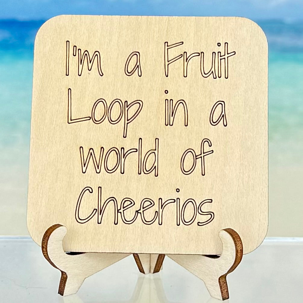 Wood-style fridge magnet: ‘I’m a Fruit Loop in a world of Cheerios’ — quirky and playful quote.