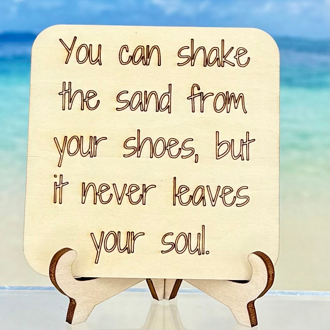 ‘You can shake the sand from your shoes but it never leaves your soul’ beach-themed fridge magnet — coastal decor quote.
