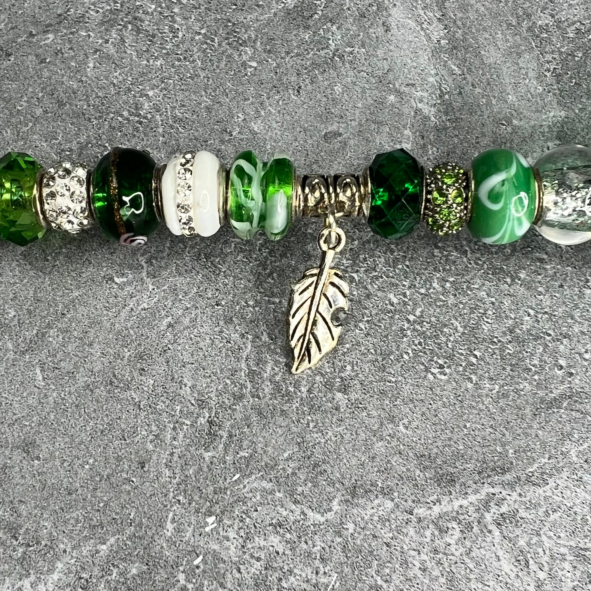 Emerald green metal garden stake in the shape of a leafy tree — elegant outdoor decor for your yard.
