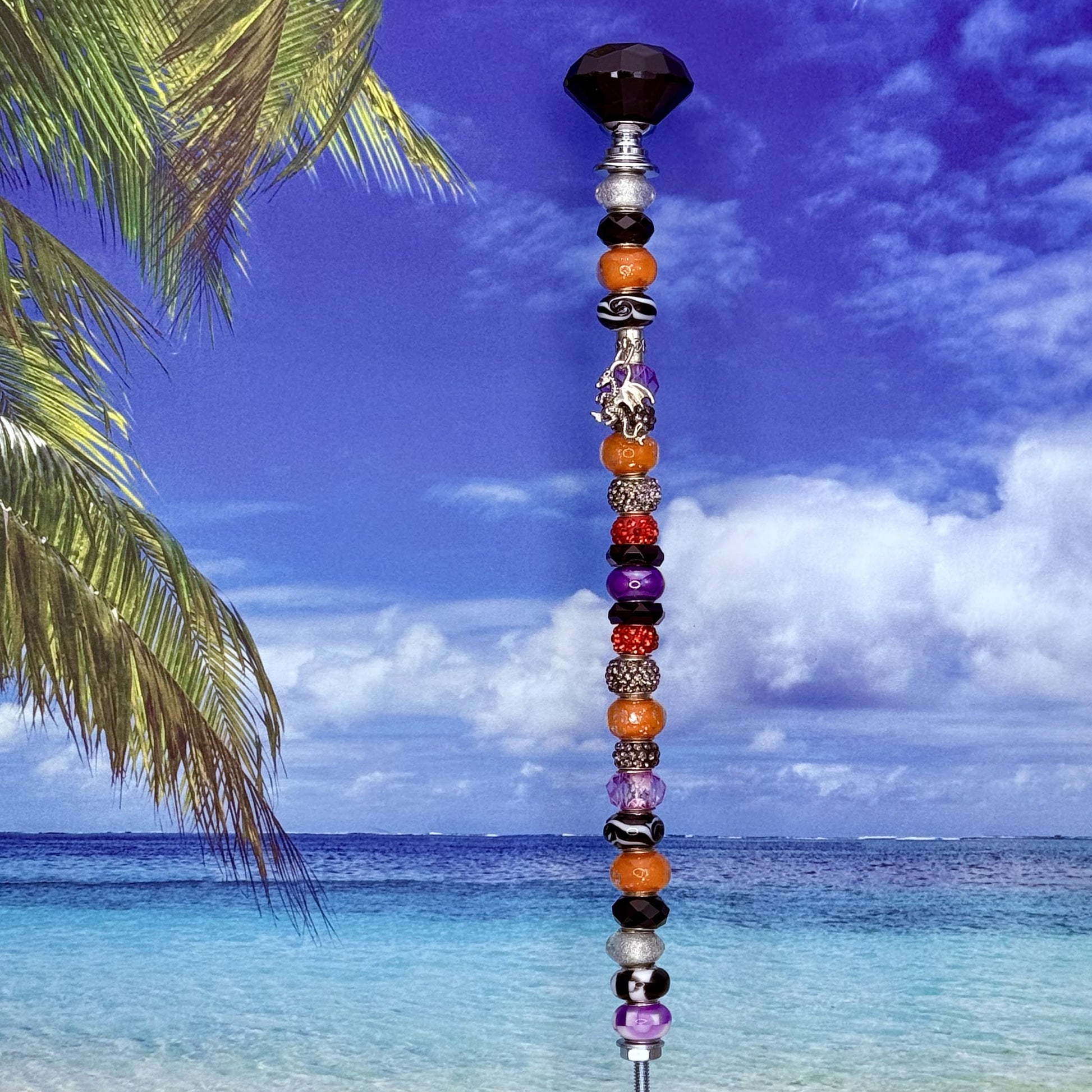 Fiery Twilight dragon garden stake — orange, purple, and black metal yard décor with fantasy design.
