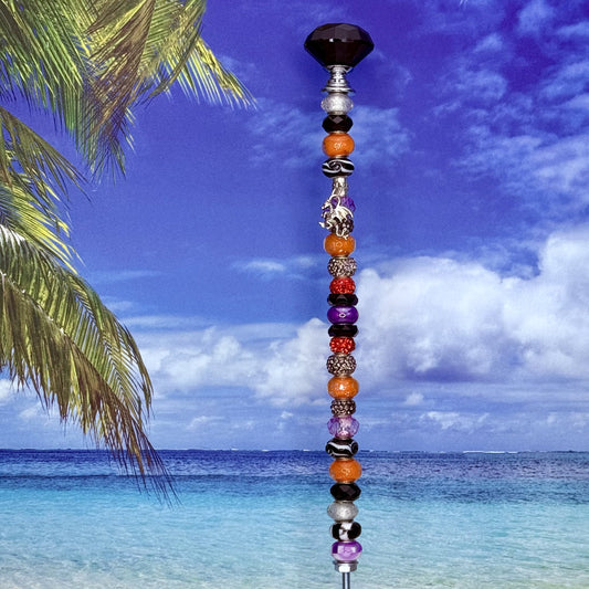 Fiery Twilight dragon garden stake — orange, purple, and black metal yard décor with fantasy design.
