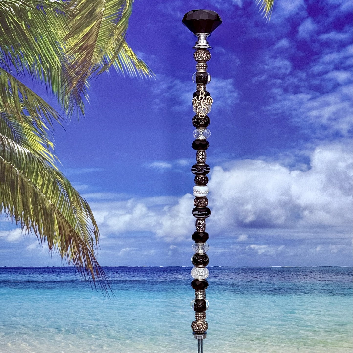 Black metal garden stake featuring a Fire & Ice dragon design — fantasy outdoor décor.
