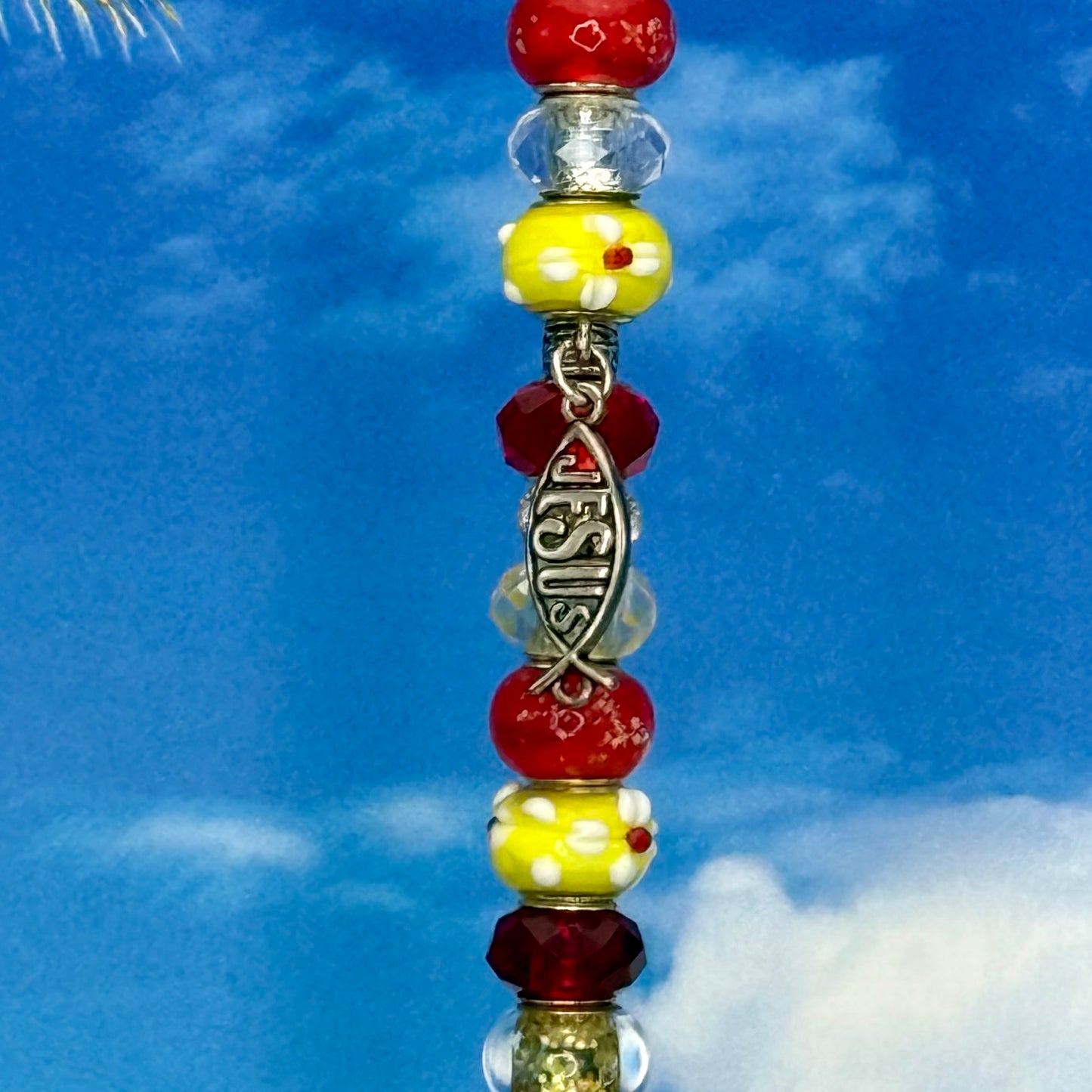 Grace & Glory garden stake with red and yellow fish design — metal yard décor for outdoor faith garden.