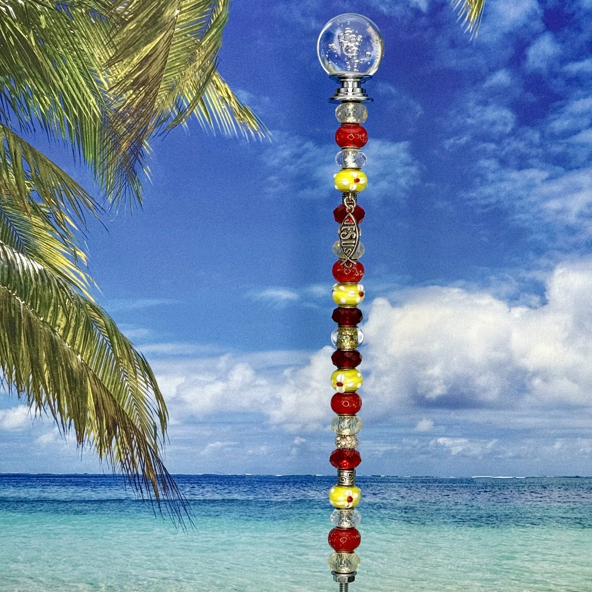 Grace & Glory garden stake with red and yellow fish design — metal yard décor for outdoor faith garden.
