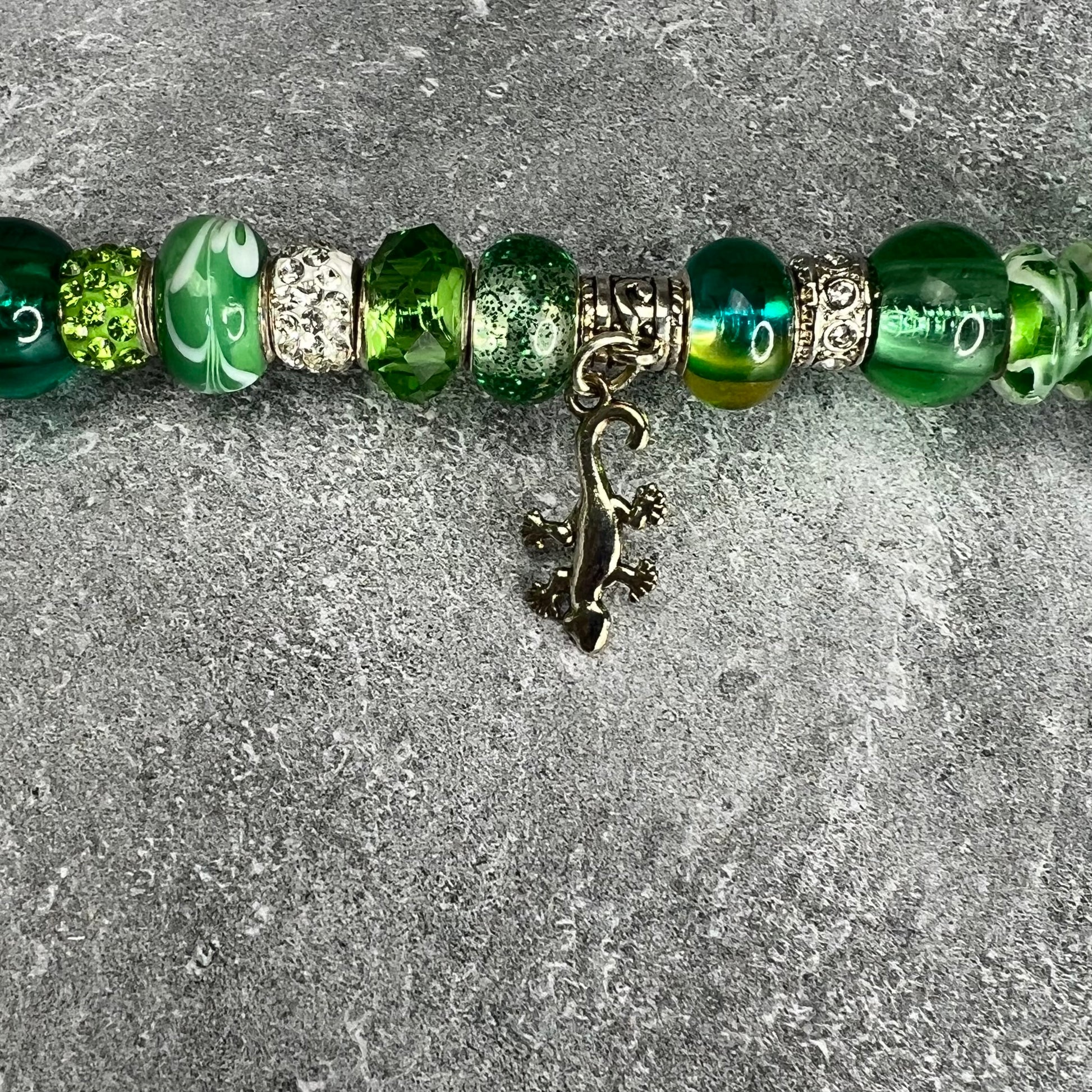 Green metal gecko garden stake — whimsical outdoor yard décor.
