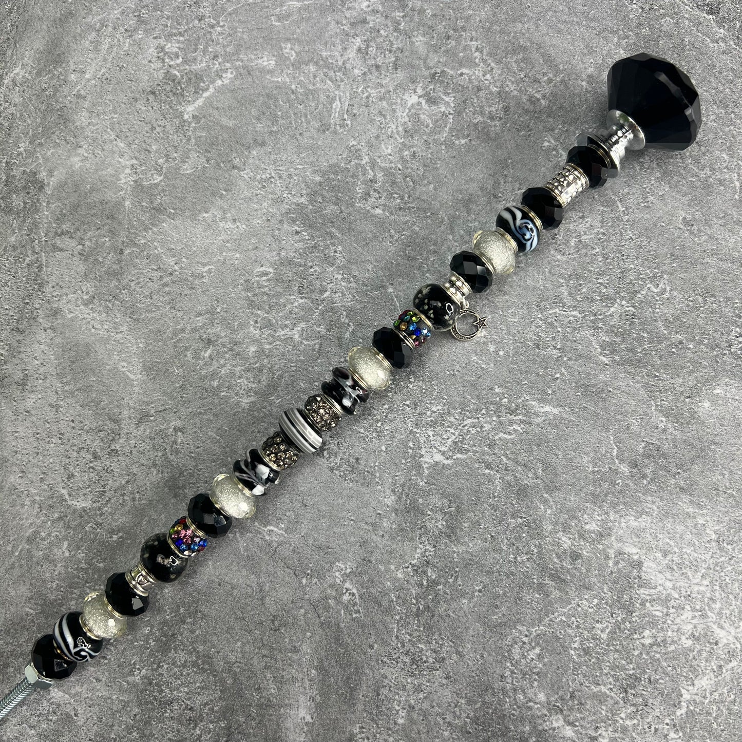 Black and white metal garden stake with moonlit starry night design — celestial outdoor décor.
