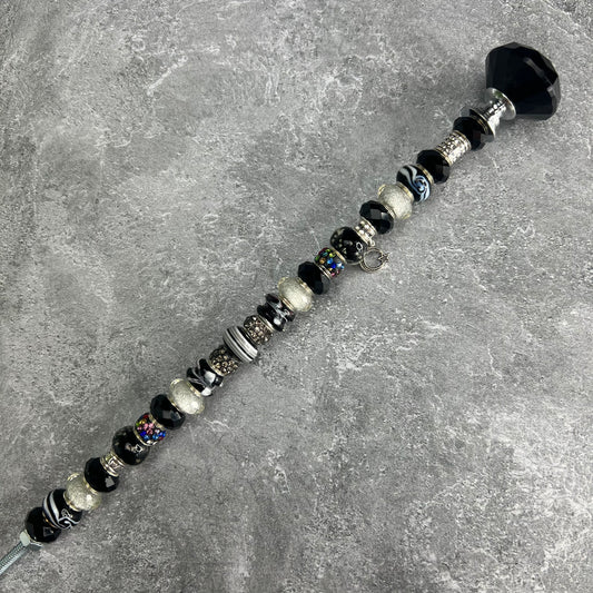 Black and white metal garden stake with moonlit starry night design — celestial outdoor décor.
