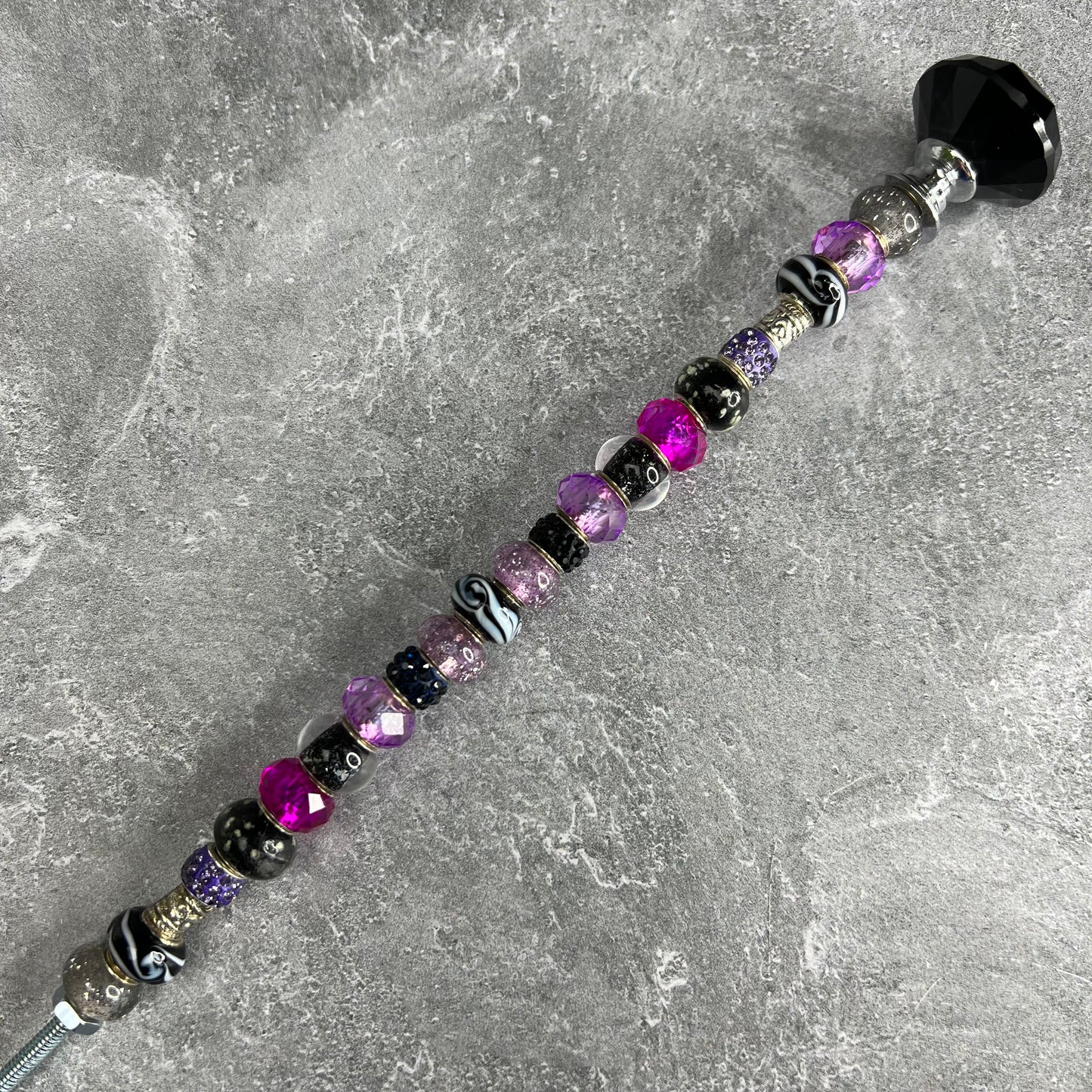 Mystic Nightshade Beauty garden stake in black and purple metal — decorative yard décor with whimsical floral design.
