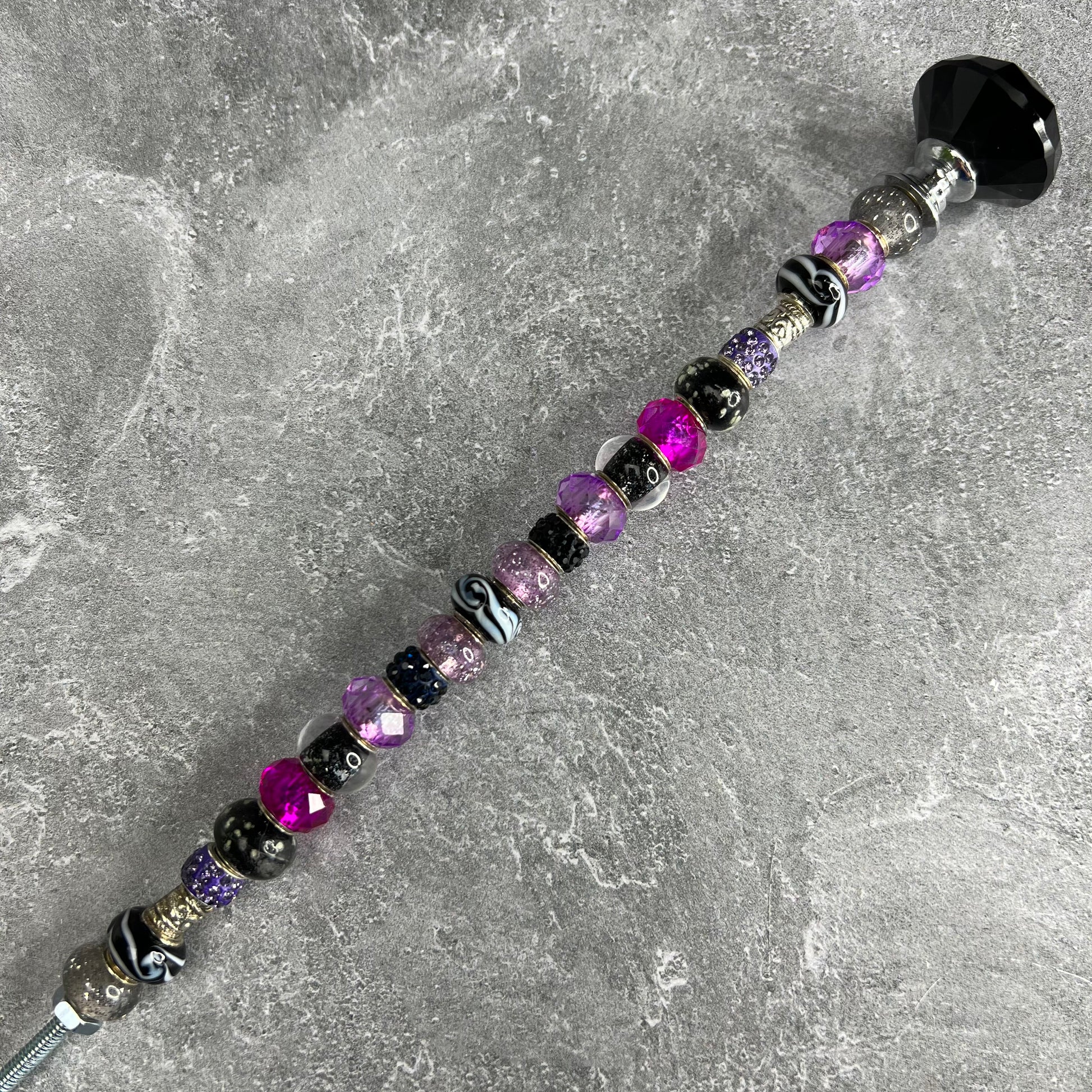 Mystic Nightshade Beauty garden stake in black and purple metal — decorative yard décor with whimsical floral design.
