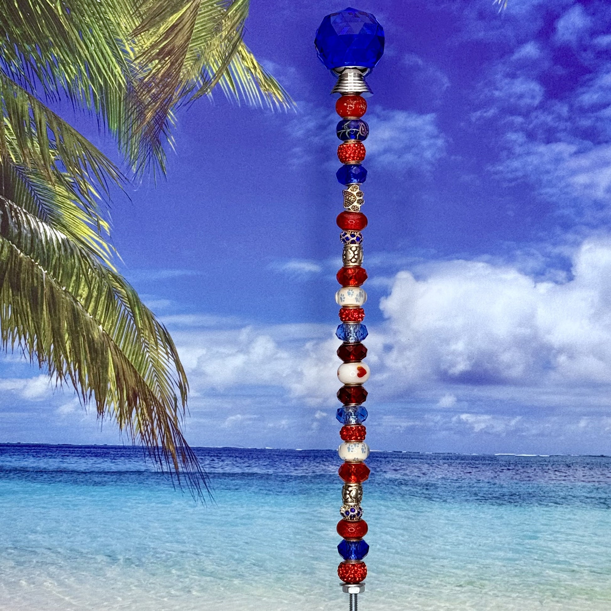 Red, white, and blue metal garden stake with paw print and ‘Pawtriot Pride’ — patriotic pet-themed yard décor.
