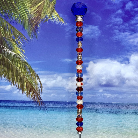 Red, white, and blue metal garden stake with paw print and ‘Pawtriot Pride’ — patriotic pet-themed yard décor.
