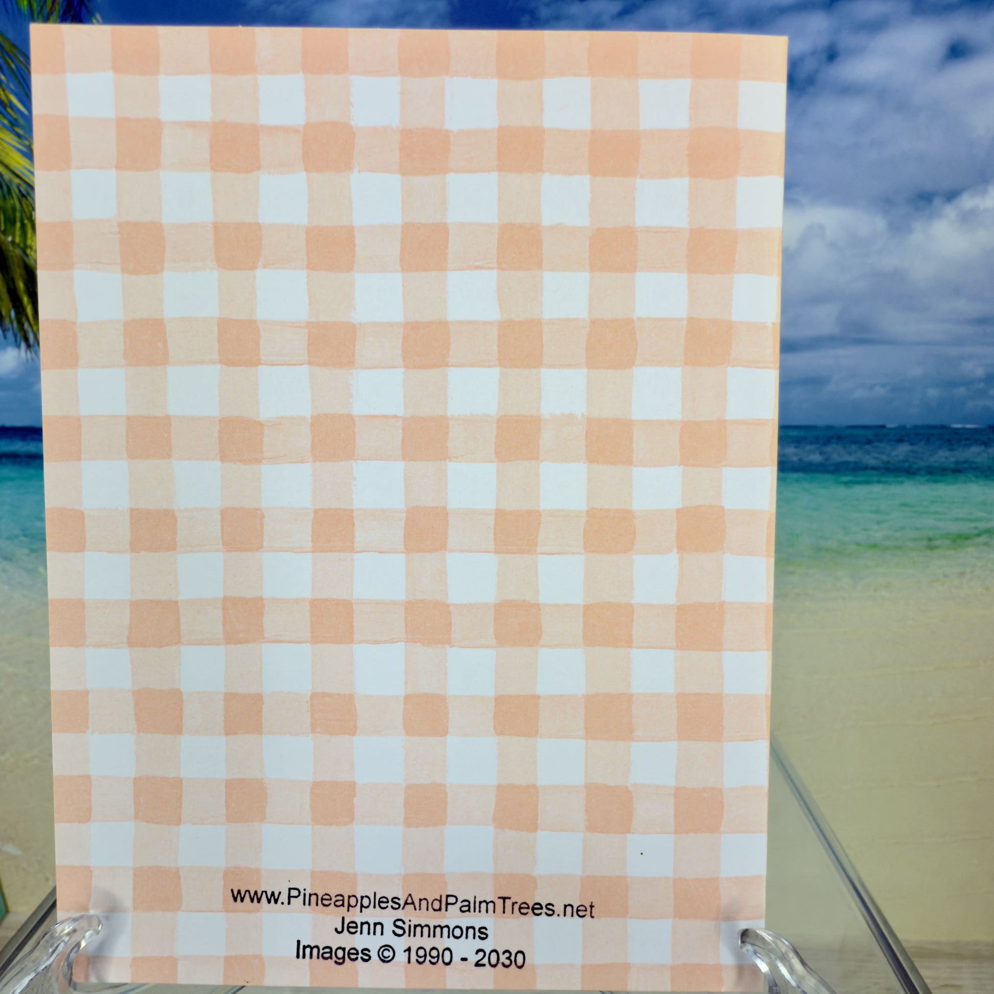 Details of the Happy Easter greeting card with two fluffy bunnies nestled among floral designs from Pineapples and Palm Trees