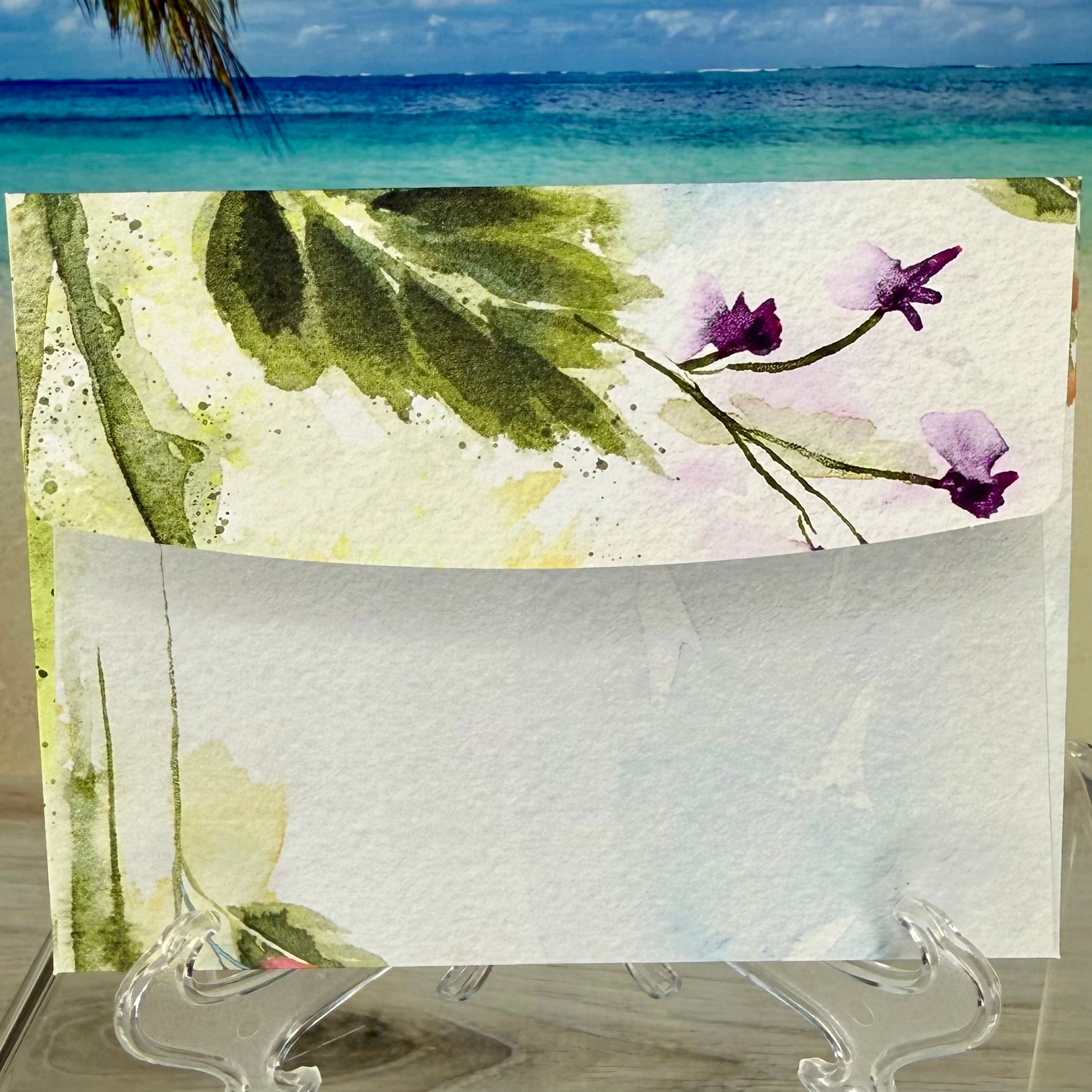 Envelope of a greeting card with cute flower illustrations.