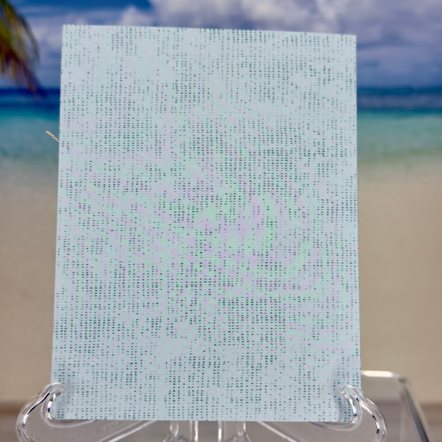 Greeting card with the words ‘Hello Spring’ surrounded by green chive stems and simple floral accents, shown with its matching envelope — light, fresh, and handcrafted.

