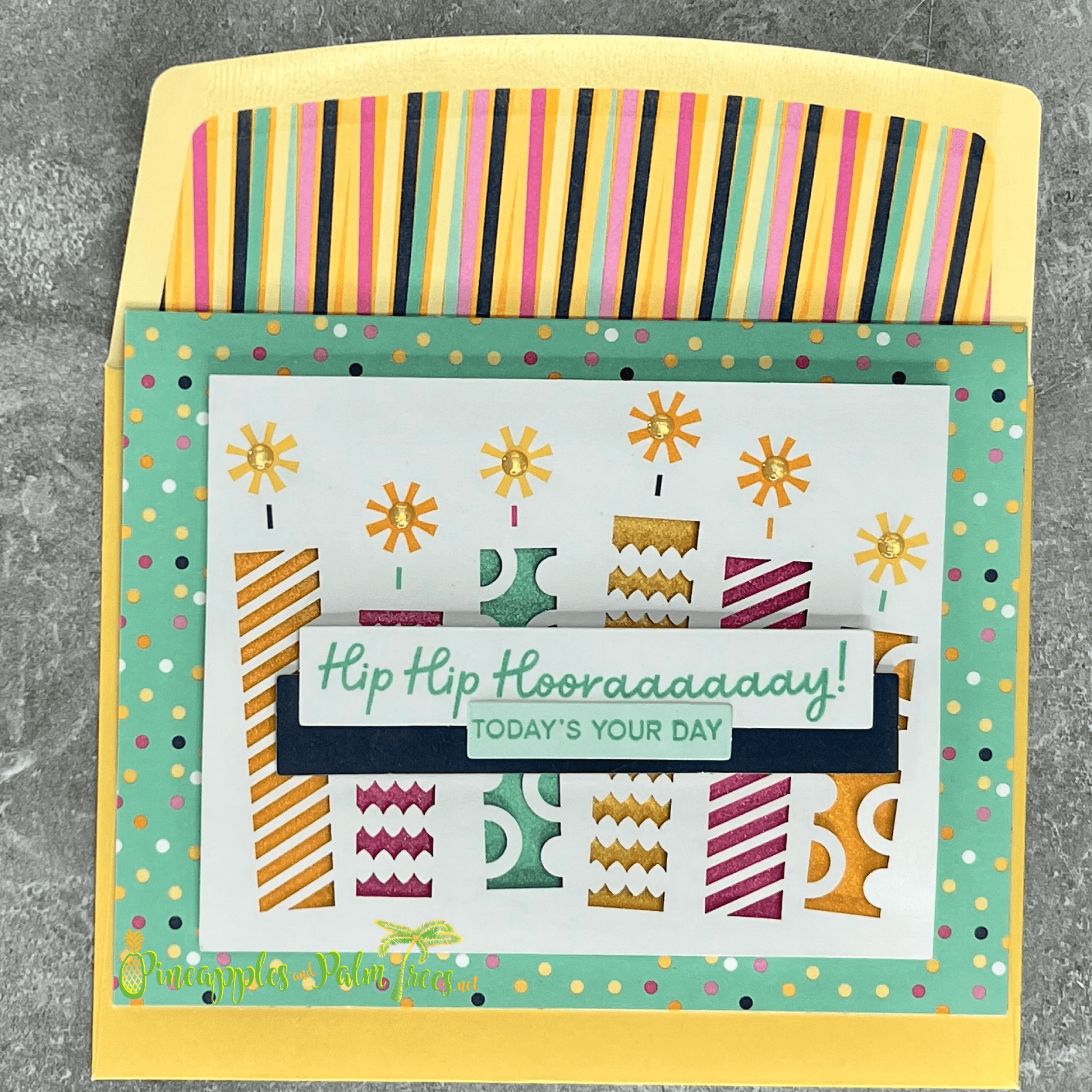 Greeting card with the message ‘Hip Hip Hooray — Today’s Your Day’ surrounded by birthday cake candles, shown with its matching envelope — celebratory and handcrafted for birthdays.