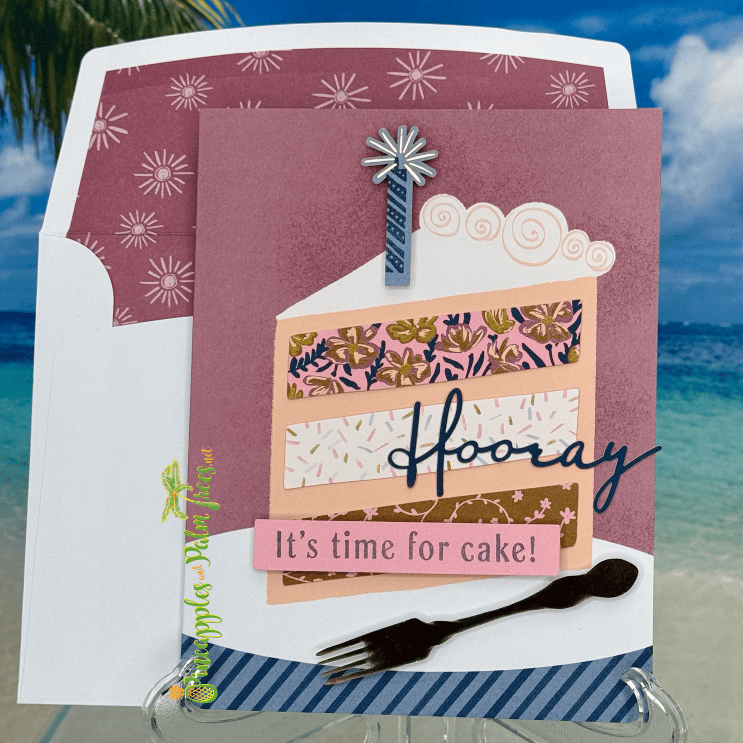 Birthday greeting card that reads ‘Hooray, It’s Time for Cake!’ with a playful fork and cake illustration, shown with its matching envelope — cheerful and handcrafted.