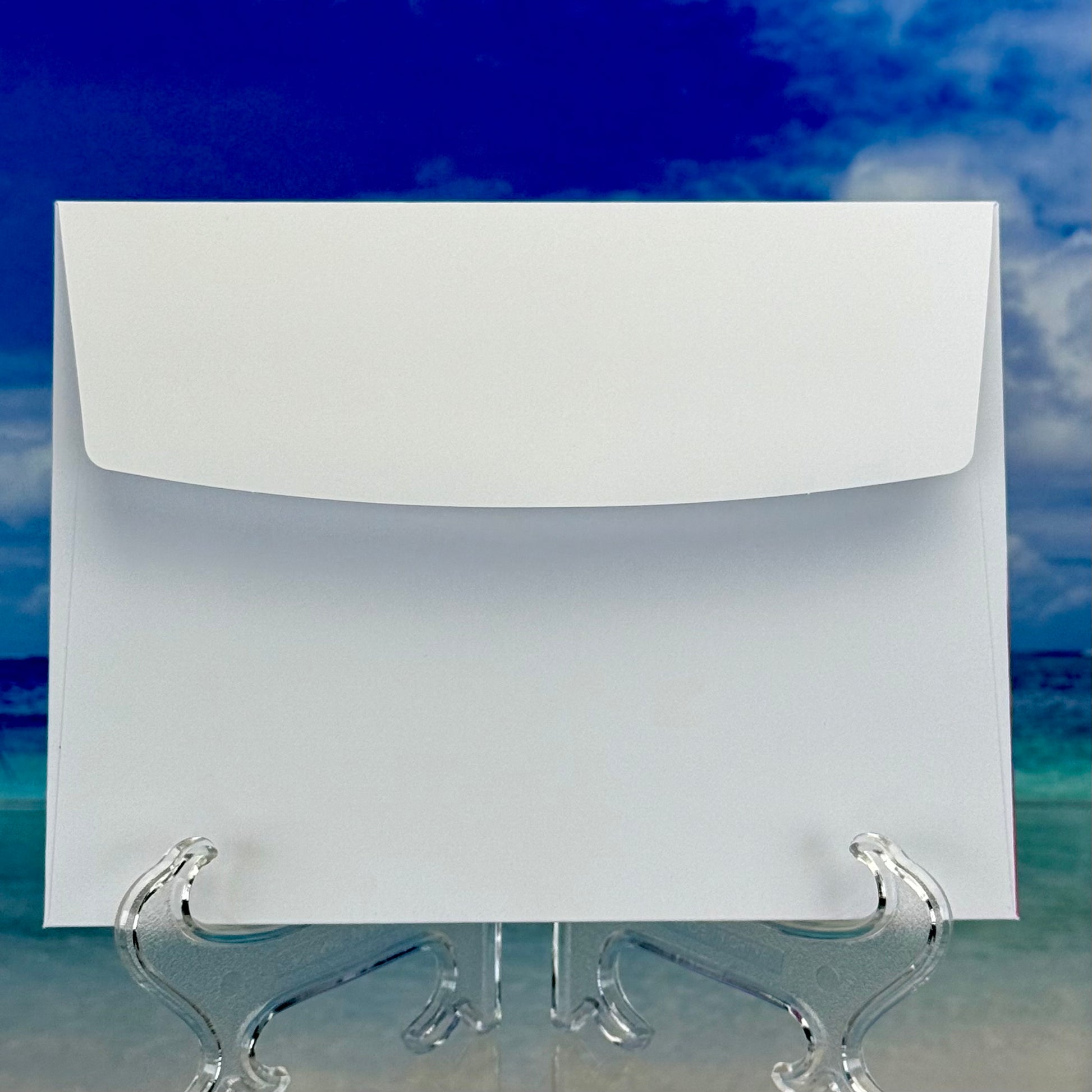 Front view of the coordinating envelope included with ‘hugs, I’m here for you' greeting card — clean white envelope ready for mailing.