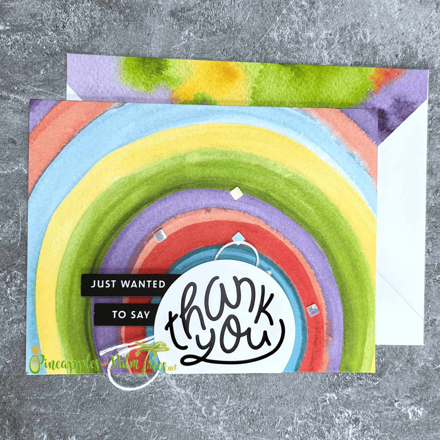 Greeting card reading ‘Just Wanted to Say Thank You’ with cheerful rainbow design, shown with its matching envelope — bright, handmade, and heartfelt.