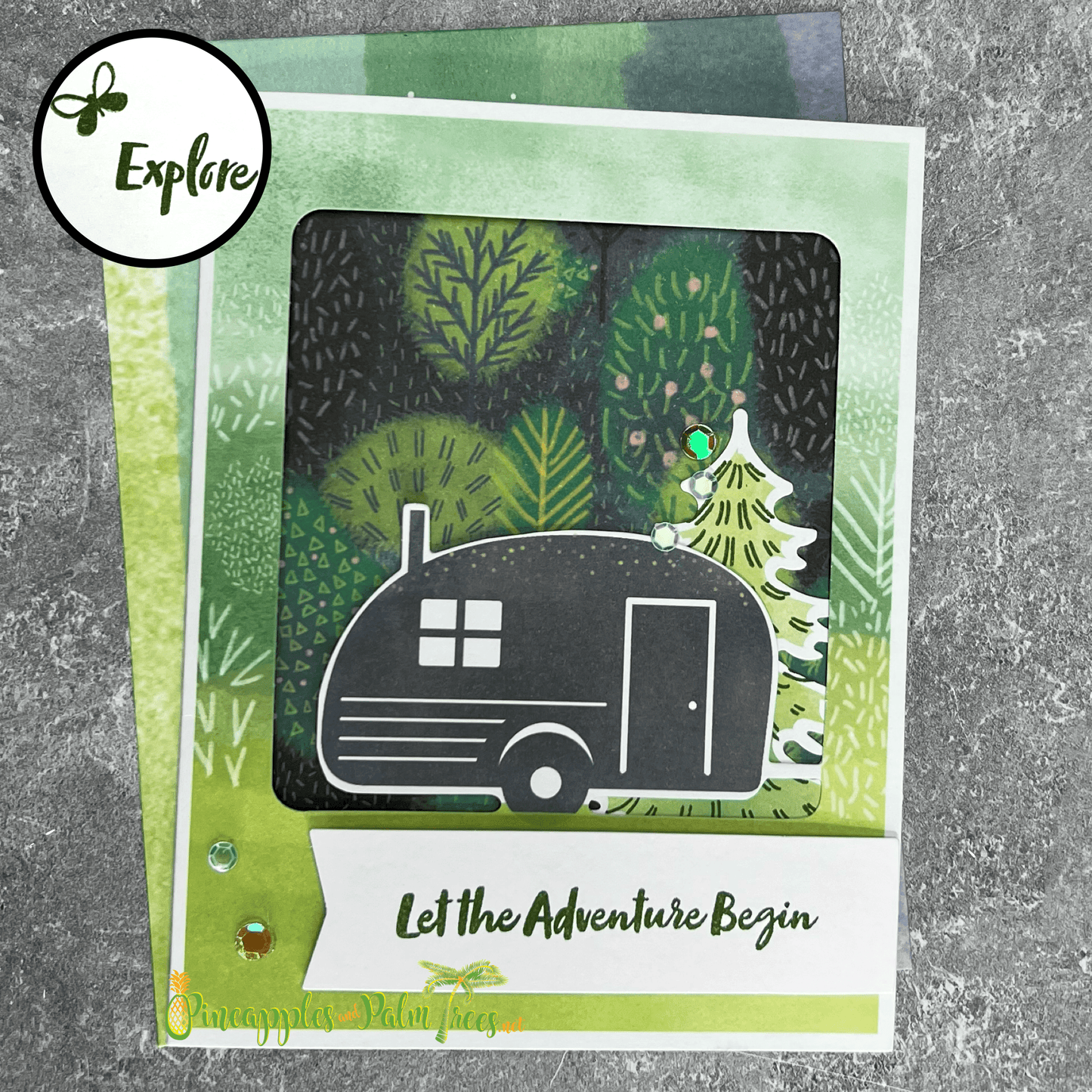 Greeting card with the phrase ‘Let the Adventure Begin’ featuring a vintage trailer illustration, shown with its matching envelope — perfect for new journeys, housewarmings or road-trip gifts.