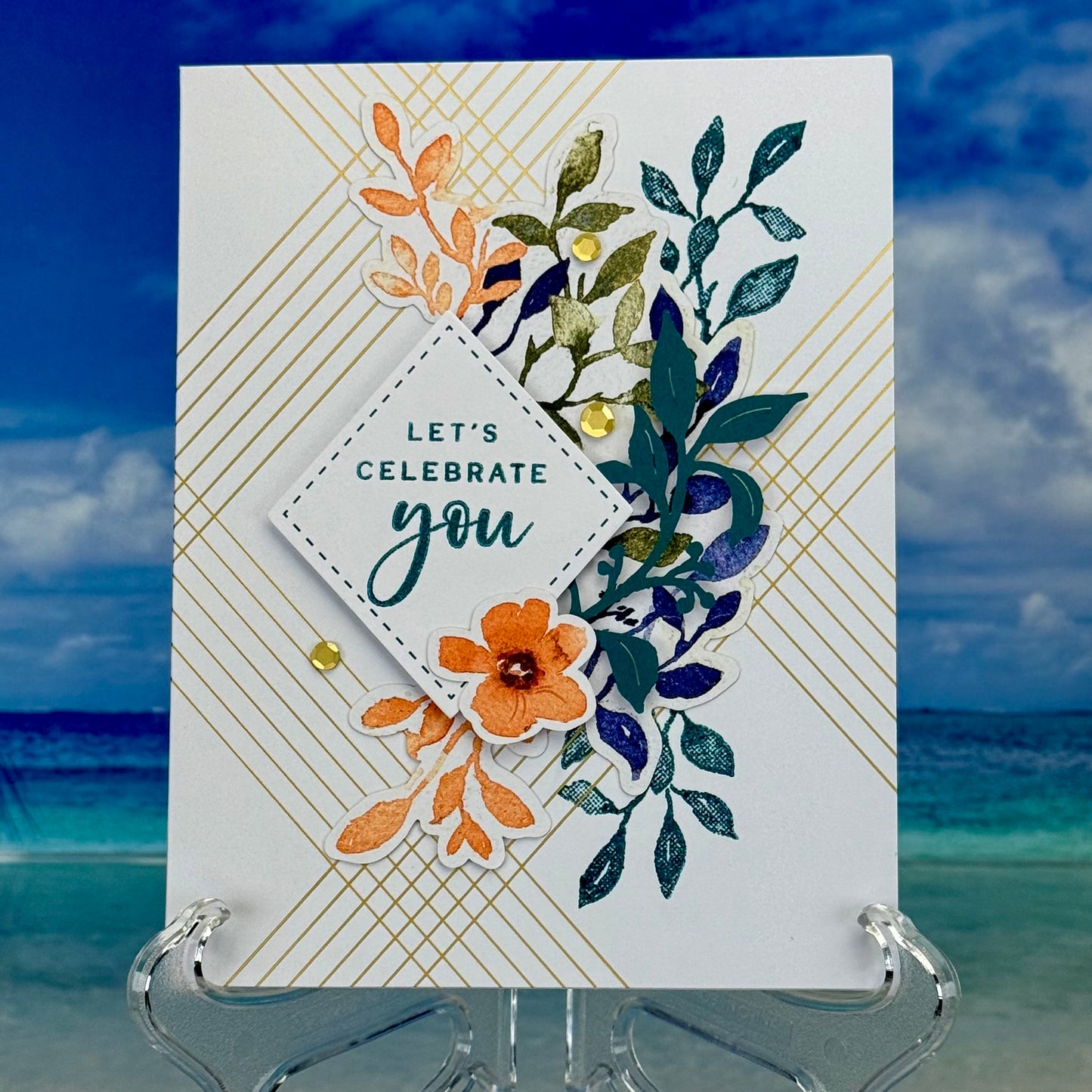 Greeting card that reads ‘Let’s Celebrate You’ with a cheerful floral illustration, displayed with its matching envelope — bright and festive design, perfect for birthdays or special occasions.